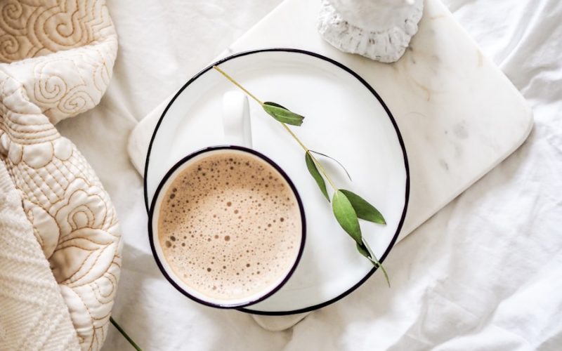 white teacup filled with coffee